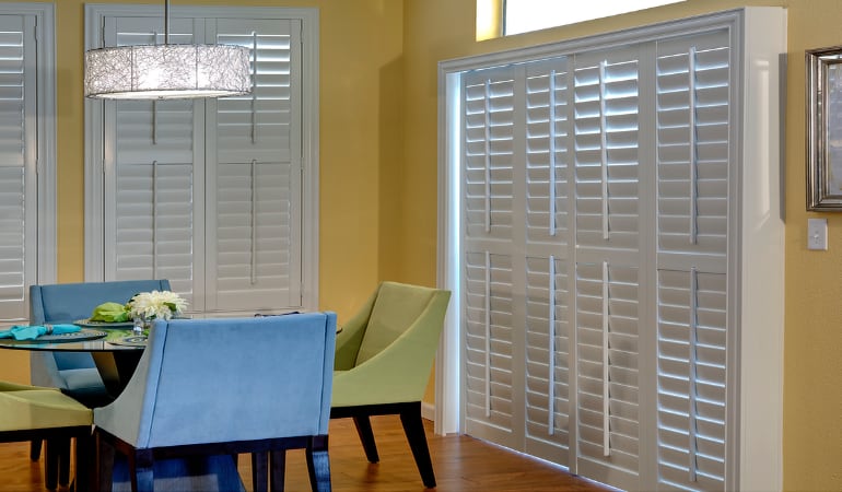 Plantation shutters on a French door act like common window shutters. Patio Doors with Plantation Shutters in New Brunswick