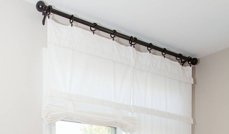 Tumble shades in New Jersey give your doors privacy versatility and style. White tumble shade on double glass doors